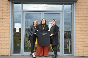 Uniq Recycling supports Burton Albion's mission to Ghana, aiding Zoe Bailey's journey with a generous donation. 